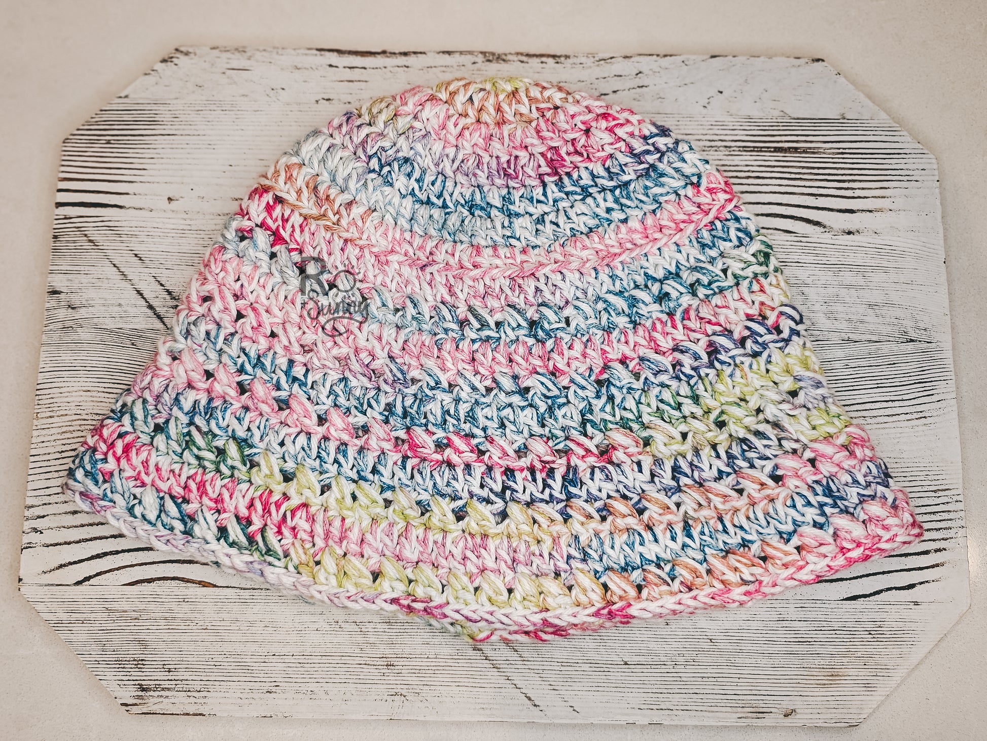 Bucket Hat in color Spring Fling - White Base with highlights of Pink, Green, Blue, Orange.