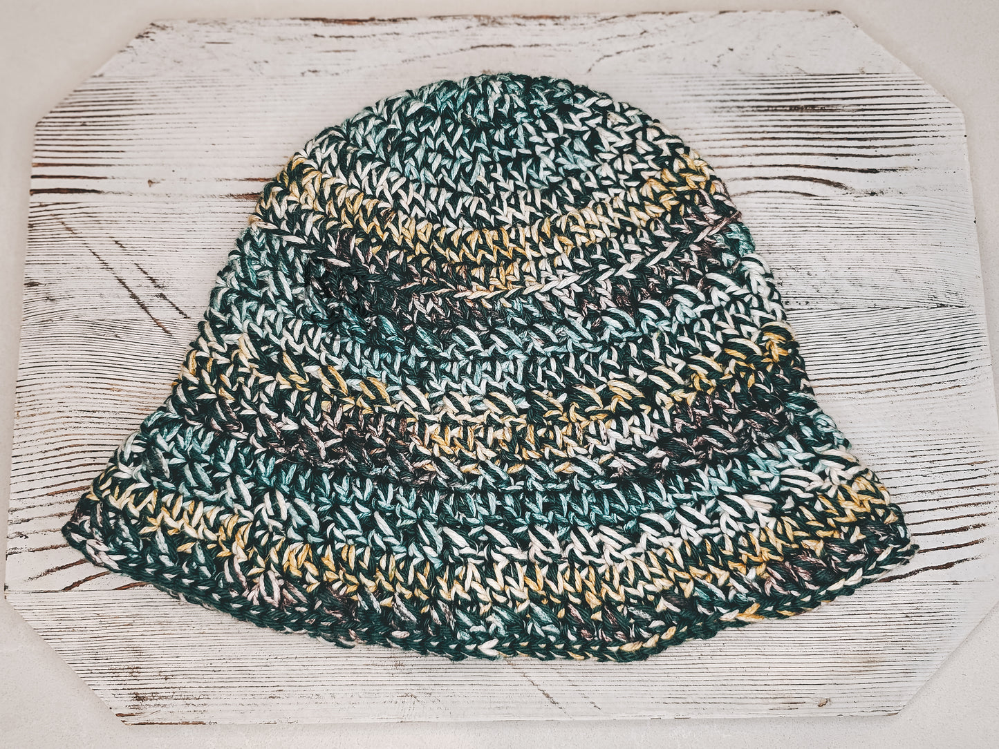 Bucket Hat in color Willamette Valley -  Dark Green Base with highlights of Yellow, White, Brown.